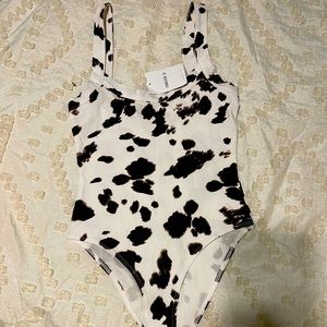 Cowprint body suit.